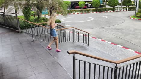 woman walking down stairs