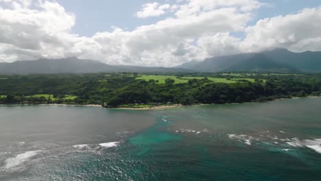 scenic drone flight over turquoise waters and green tropical wilderness of hawaiian island of kauai