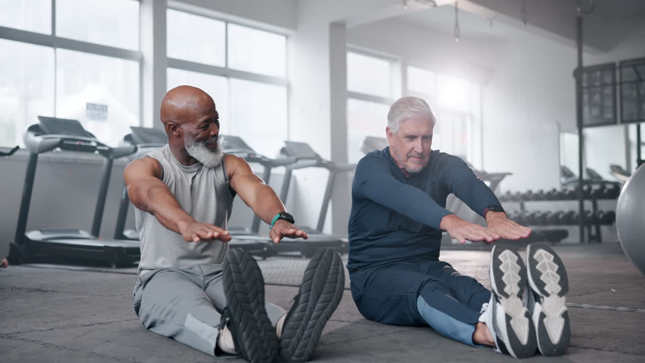 Senior men stretching in the gym