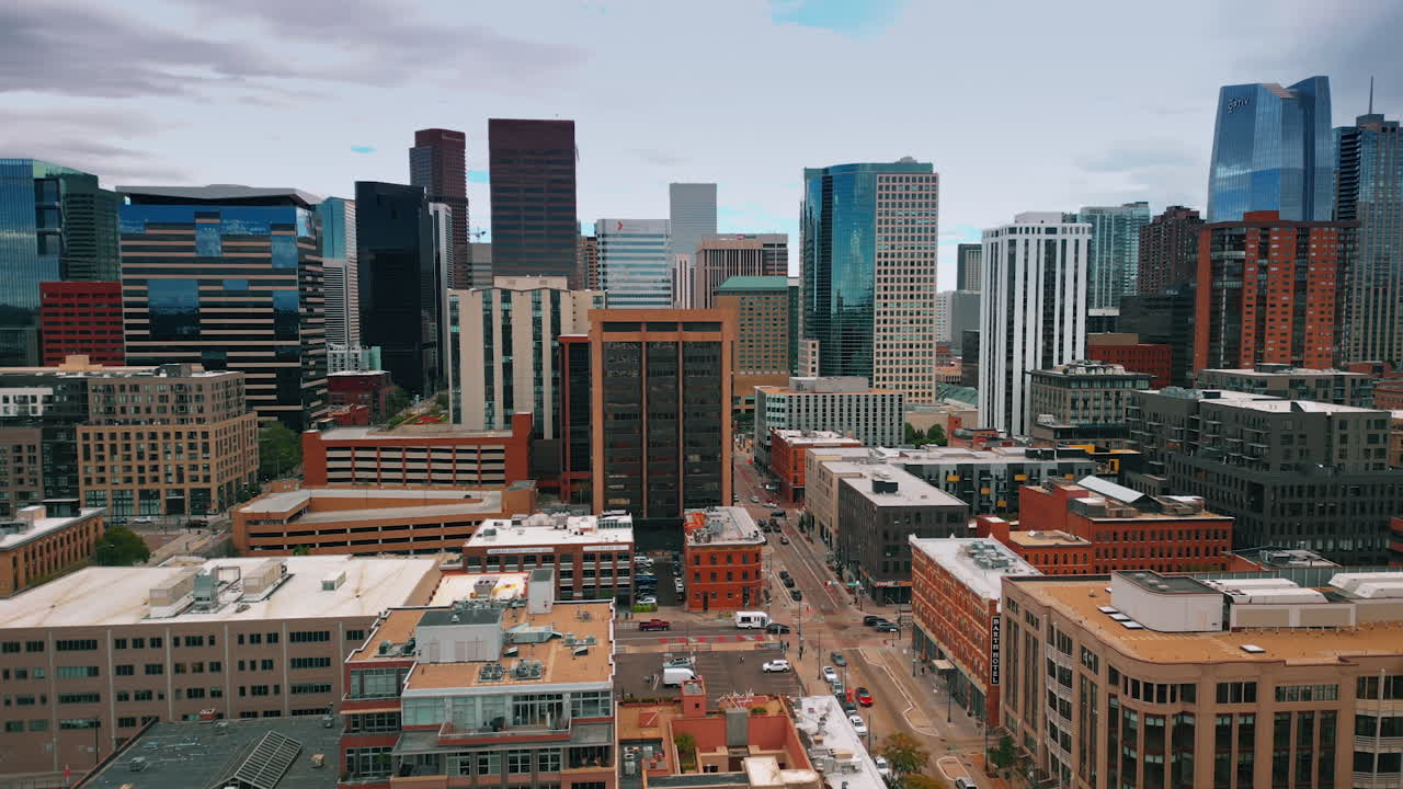 Denver, USA, 24 August 2025: Urban scenery of modern city from drone footage. Cars move by the streets of Denver, Colorado, USA