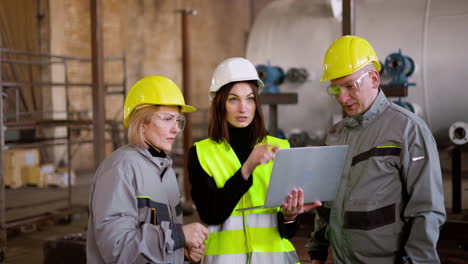 three co-workers at the factory