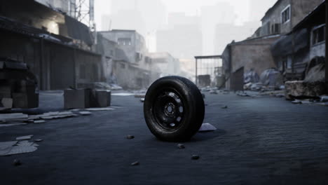 a tire lies in the middle of a destroyed city street