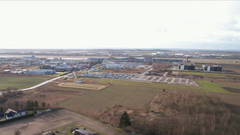 Distant-Aerial-View-of-Gdansk-Airport-on-Winter-Day---establishing-shot