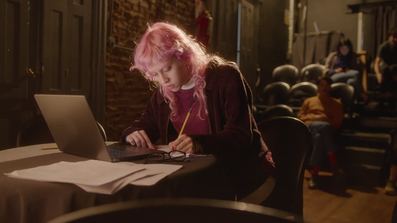 Portrait of Young Female Playwright Working in Theater