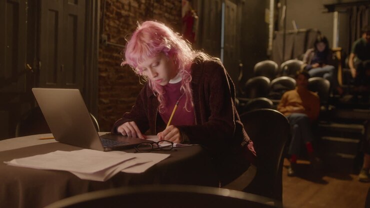 Portrait of Young Female Playwright Working in Theater
