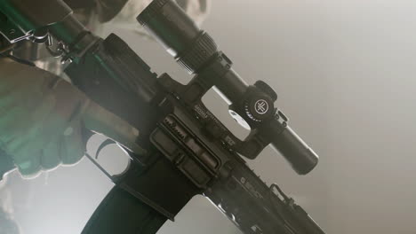 close-up shot of an unrecognizable man loading rifle and getting ready for playing airsoft