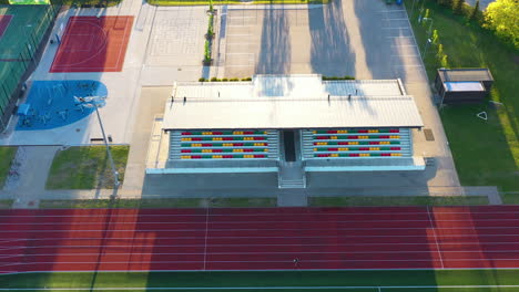 aerial view of track and field area with basketball court and outdoor gym