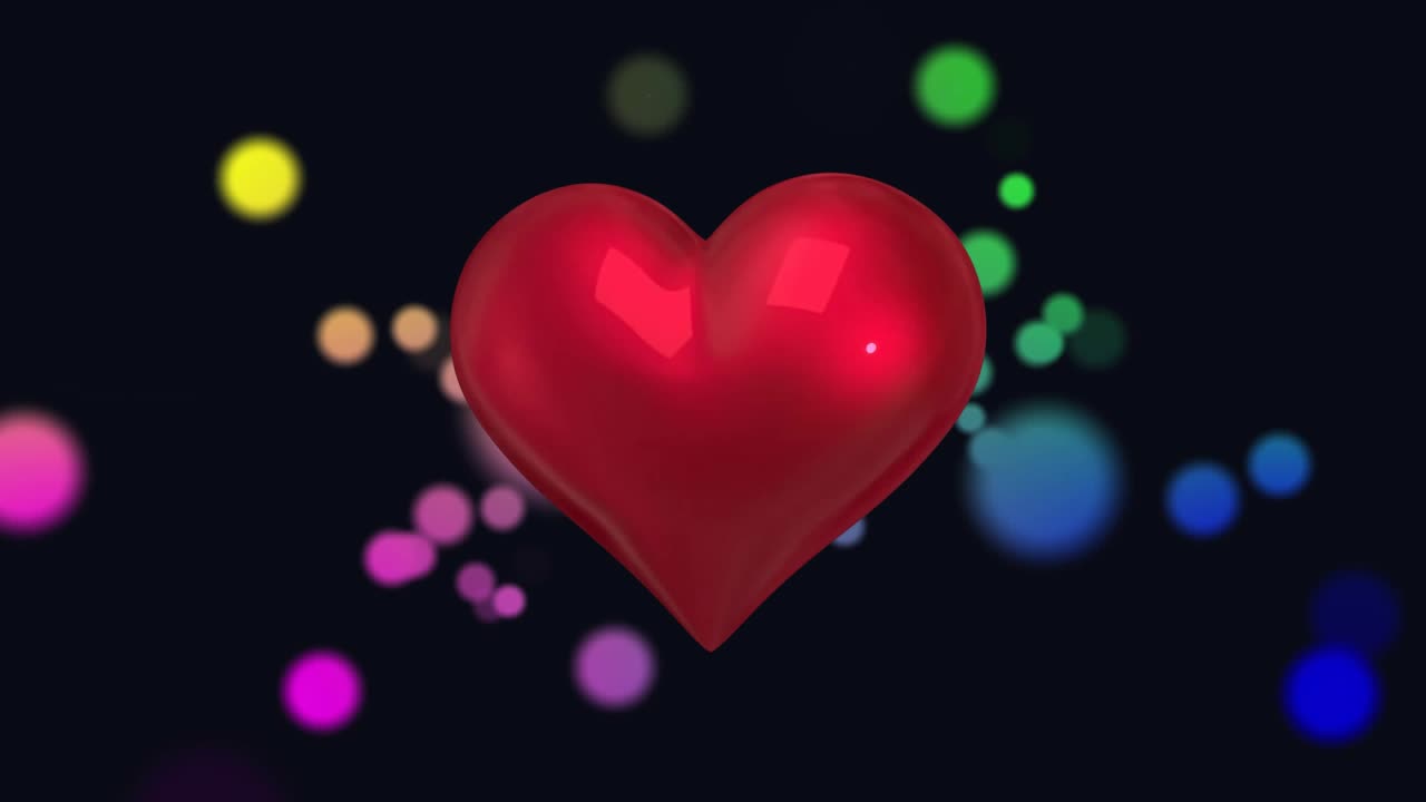 After appearing at center heart rotating pulsing tilting turning while lights drifting into balance