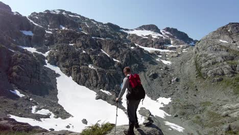 man looking up at mountains of vancouver island, canada - big interior mountain