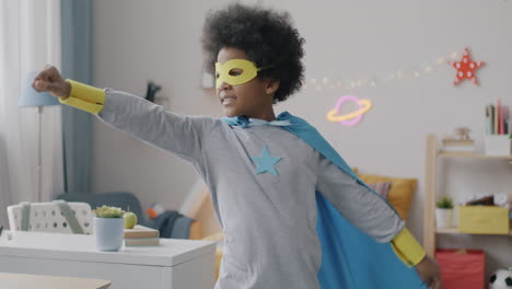 child playing superhero costume