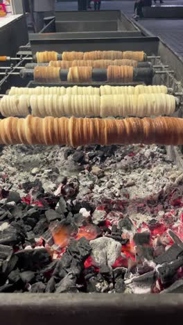 kürtőskalács baking over coals