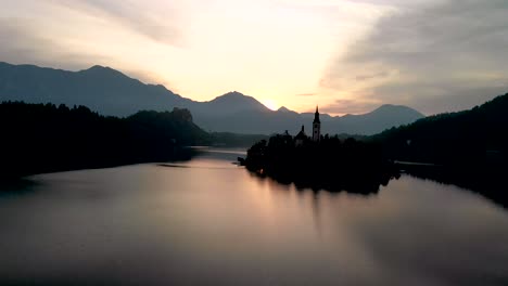 a beautiful reflection of lake bled at sunrise