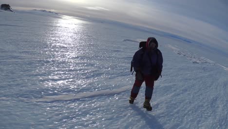 person hiking on arctic ice