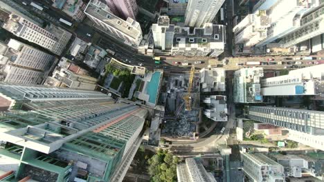 Downtown-Hong-Kong-city-skyscrapers-and-urban-traffic,-Aerial-view