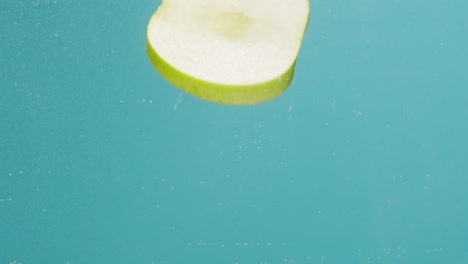 Green Apple Slice in Water Splash