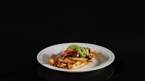 plate of nacho fries with various toppings