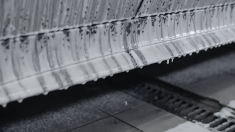 car undergoing foam wash in a wash bay