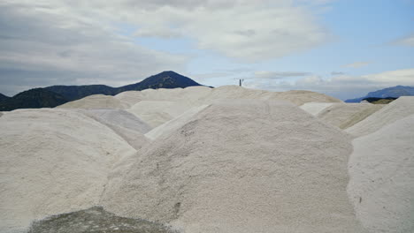 large piles of salt at an outdoor production site