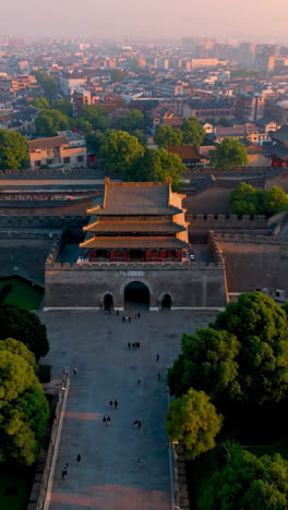 aerial view of a historical city gate in china at sunrise
