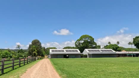 a scenic walk towards a rural house under blue skies