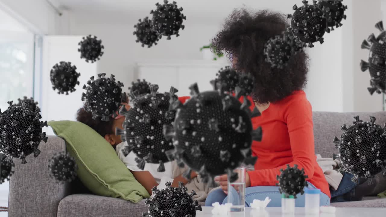 소파에 누워있는 아프리카계 미국인 여성과 그녀의 아들의 위에 바이러스 세포의 애니메이션