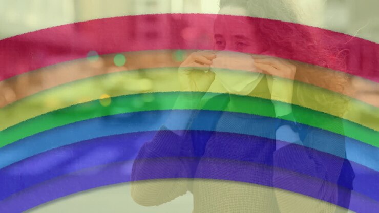 Rainbow against woman wearing face mask
