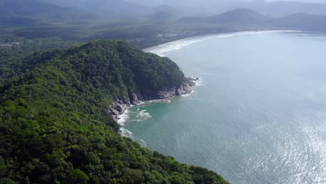 aerial overview of the rocky and mountainous coast of sunny costa verde, brazil - panoramic, drone shot