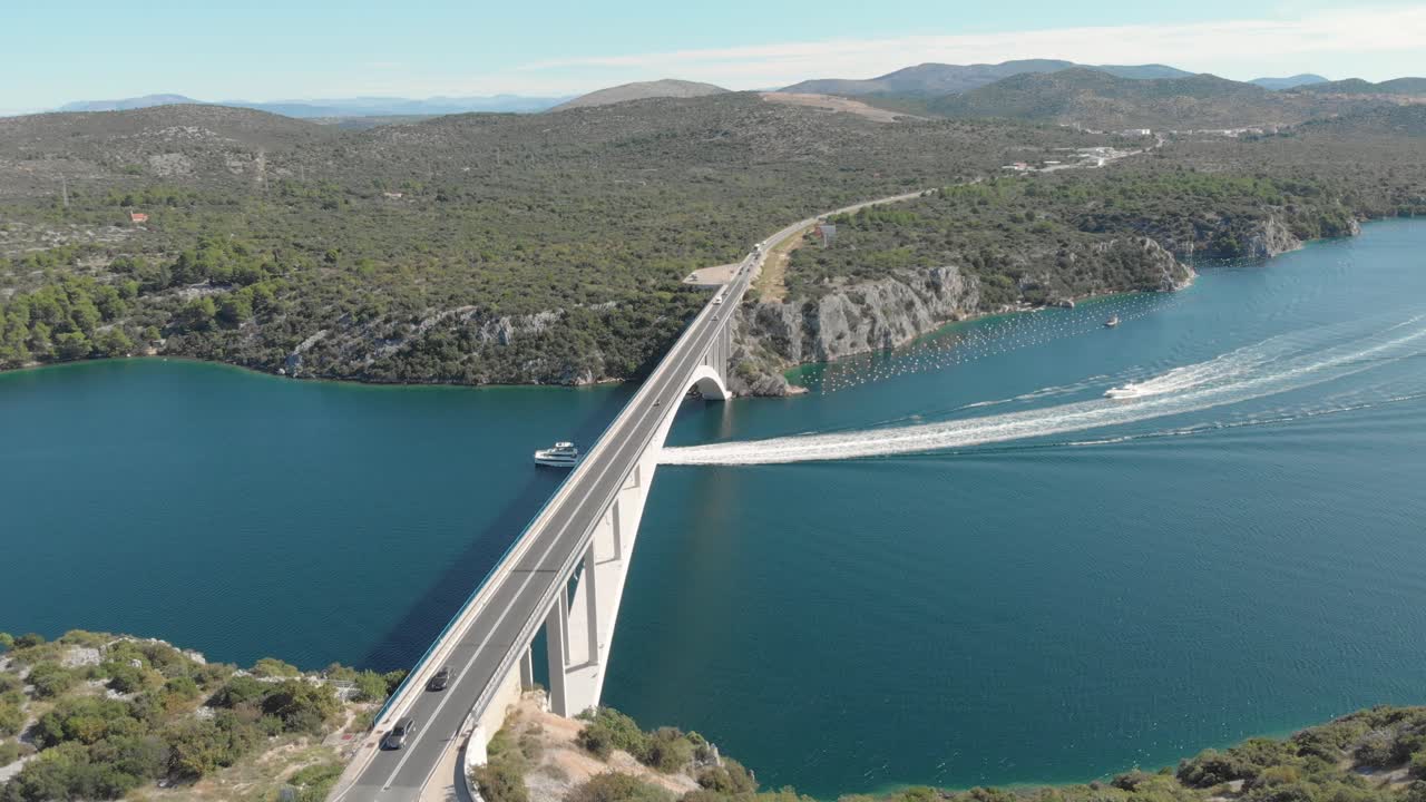 Birds eye view of highway bridge for traffic, connecting the two mountain sides over Adriatic sea coast, Croatia. Aerial