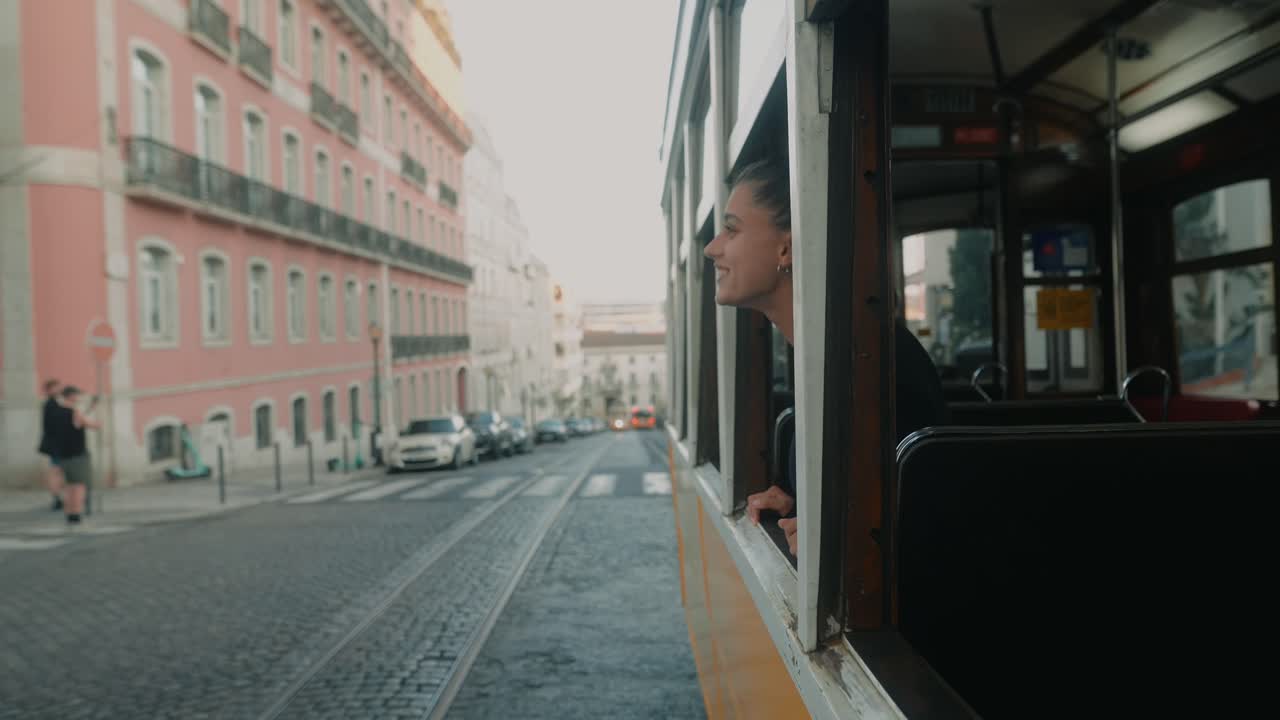 Woman riding a tram in a European city