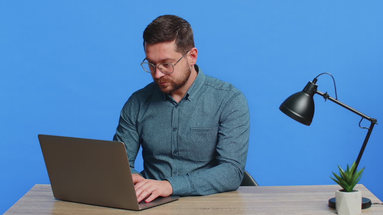Happy man working on laptop shocked by victory celebrate winning goal achievement good career news
