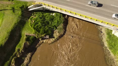 drone shot flying over a river, seeing people in transport