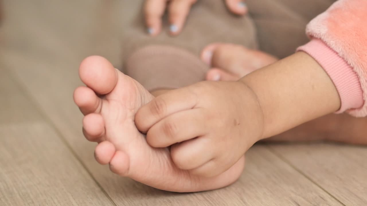 Child putting on socks or shoes