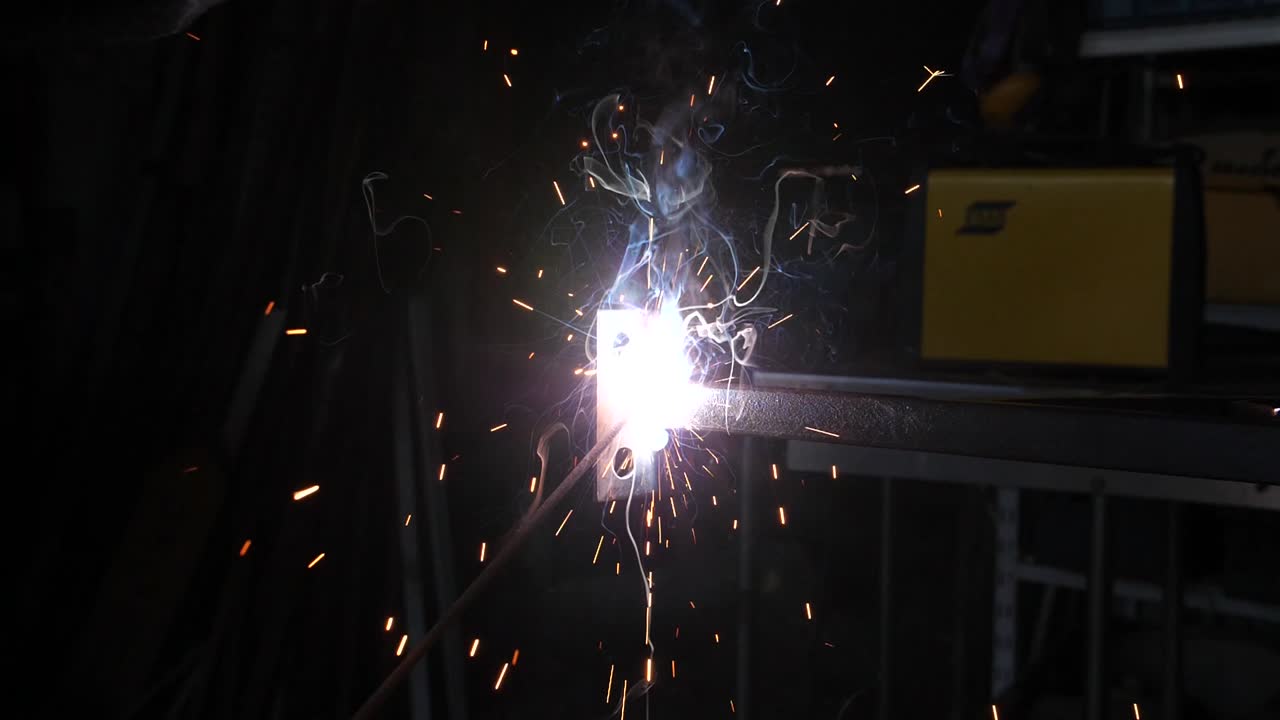 Man welding in slow motion in his workshop.