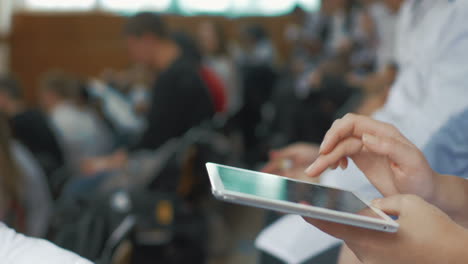 Woman-doctor-using-touch-pad-on-medical-conference