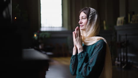 woman praying on her knees