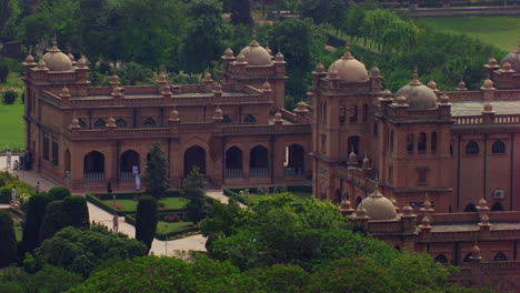 aerial view of a beautiful old heritage building, close view of the building, crossing the telecom tower placed at the front of the building