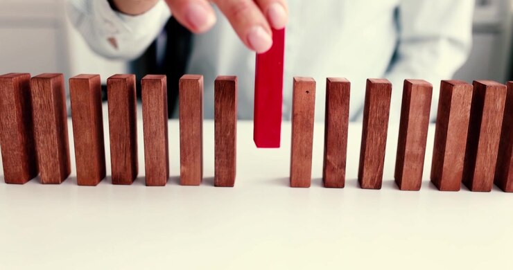 Disruption and change the significant impact of one single red domino in a continuous row