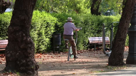 elderly man exercising in a park
