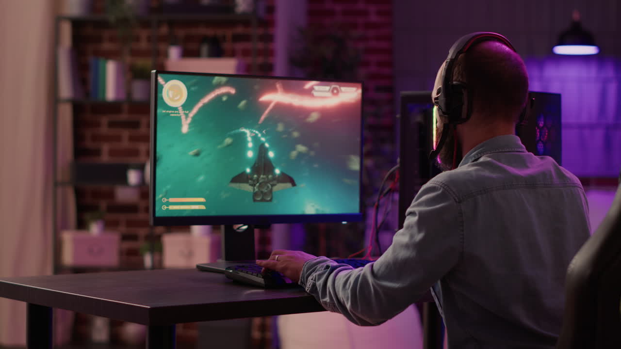 Caucasian gamer playing fast paced space shooter simulation enjoying victory after winning difficult gaming competition