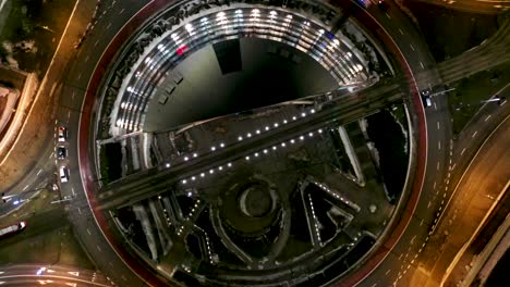 Aerial-drone-view-of-roundabout-Generała-Ziętka-in-Katowice---Day-to-night-transition