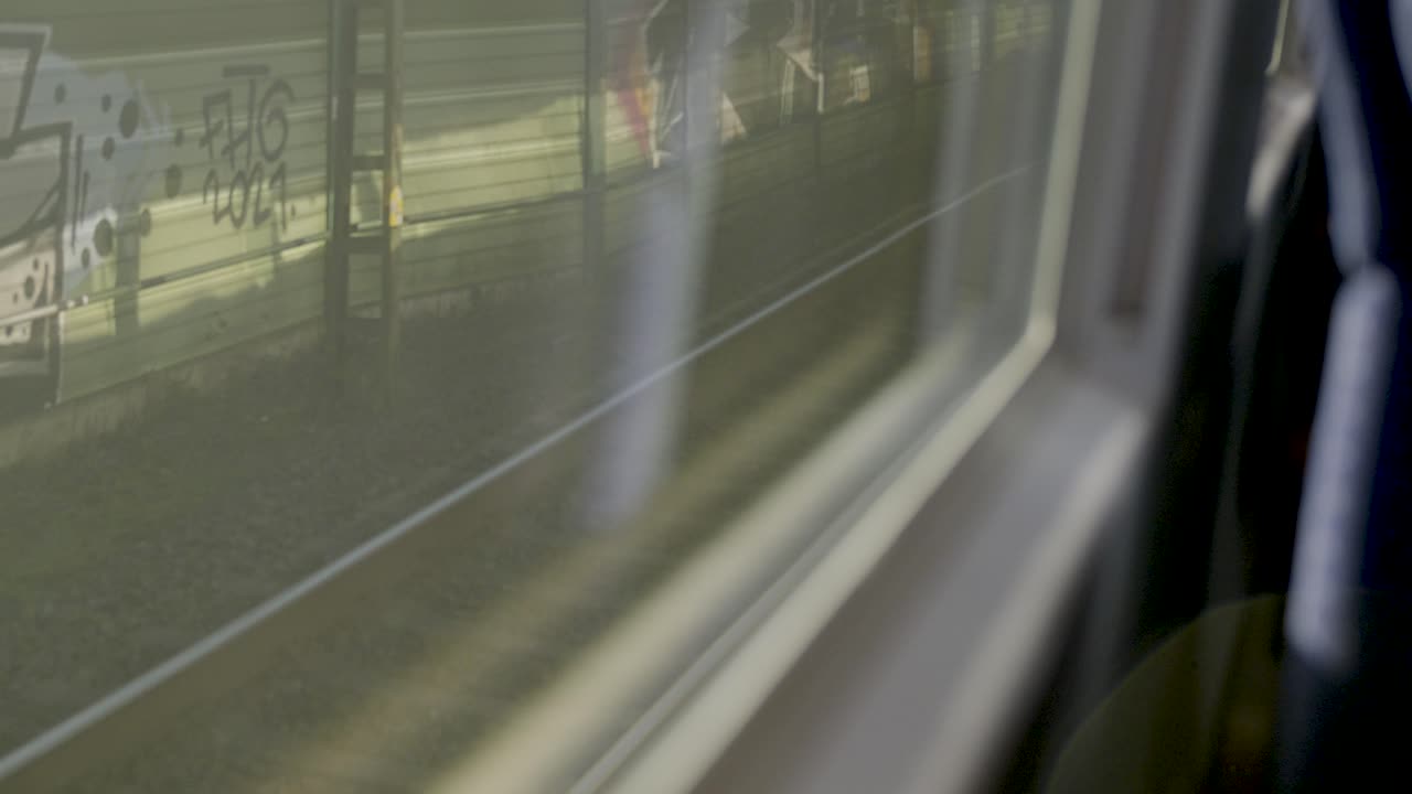 Inside a German ICE high-speed train with a blurred view through the window