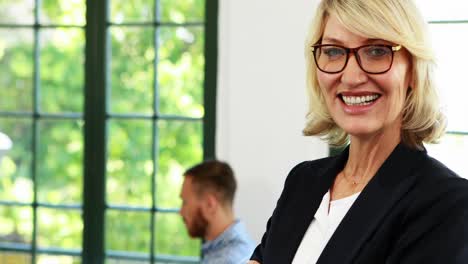 Businesswoman-standing-with-arms-crossed-4k