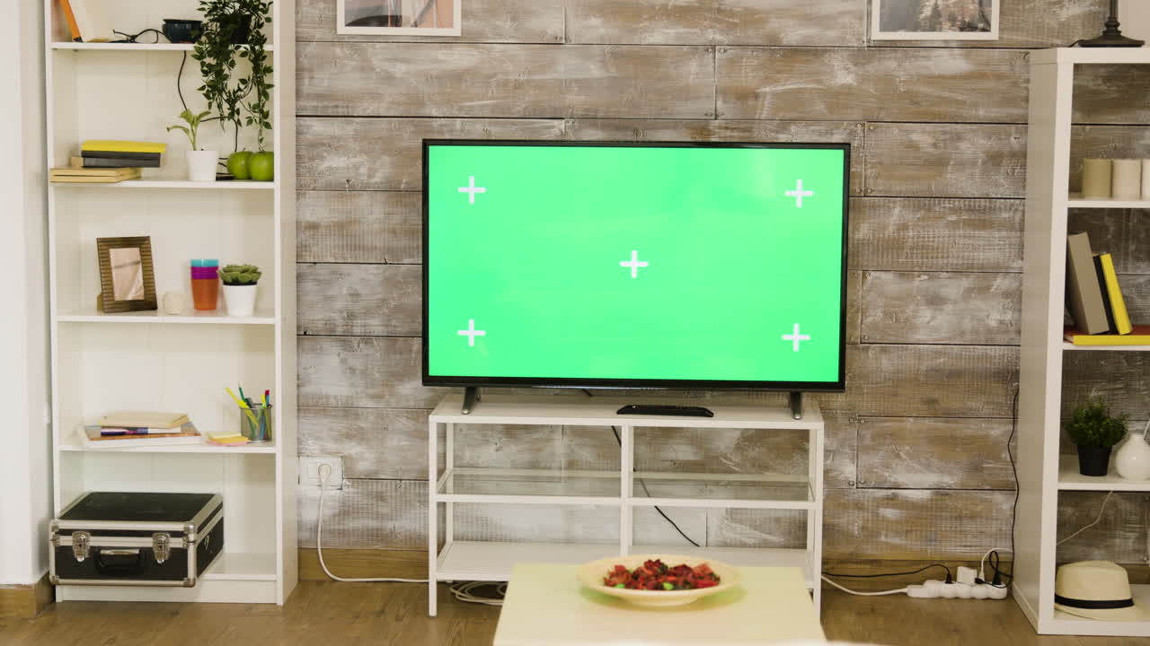 Living room with green screen television