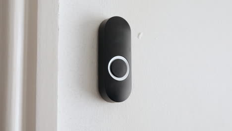 apartment door bell being pressed