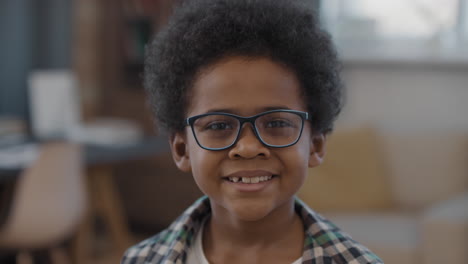 closeup portrait of smiling afro kid