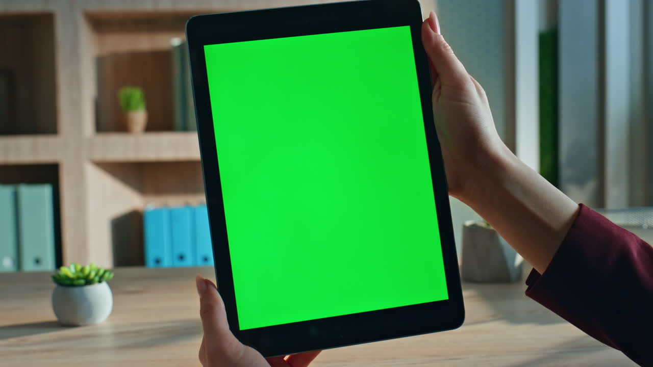 Lady boss watching green screen tablet in workplace closeup. Unknown freelancer