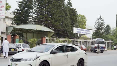 experience the welcoming entrance of the department as you approach the bustling road, showcasing the vibrant activity and accessibility that surrounds it.