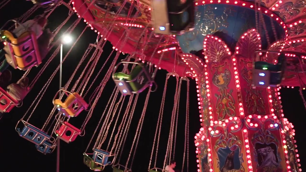 Colorful carousel at night in a park