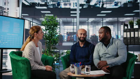 vertical video group of diverse business partners meeting for a new contract negotiation