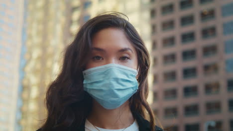 asian girl in mask posing on camera closeup. concept healthy life in pandemic.